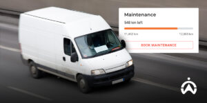 White van on the highway with vehicle service data overlay as one of the fleet analysis reports for logistics business efficiency.