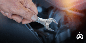Technicians perform car engine maintenance for free Cartrack GPS tracker installation services.