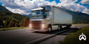 Trucks drive on toll roads with the implementation of driver monitoring systems for driving safety.