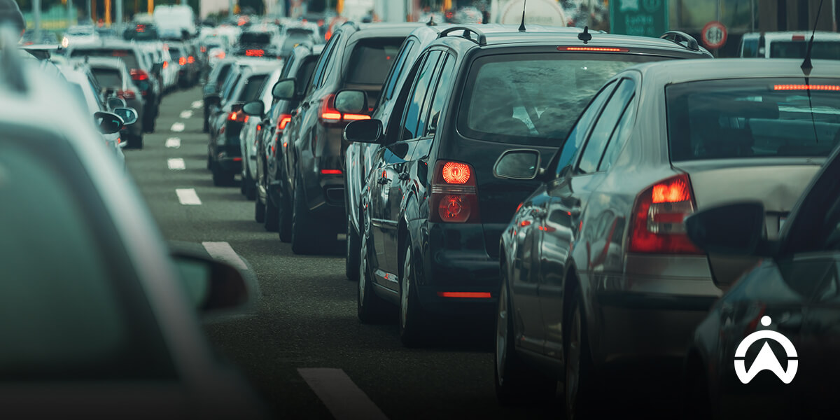Traffic jam with rows of cars and illuminated brake lights.