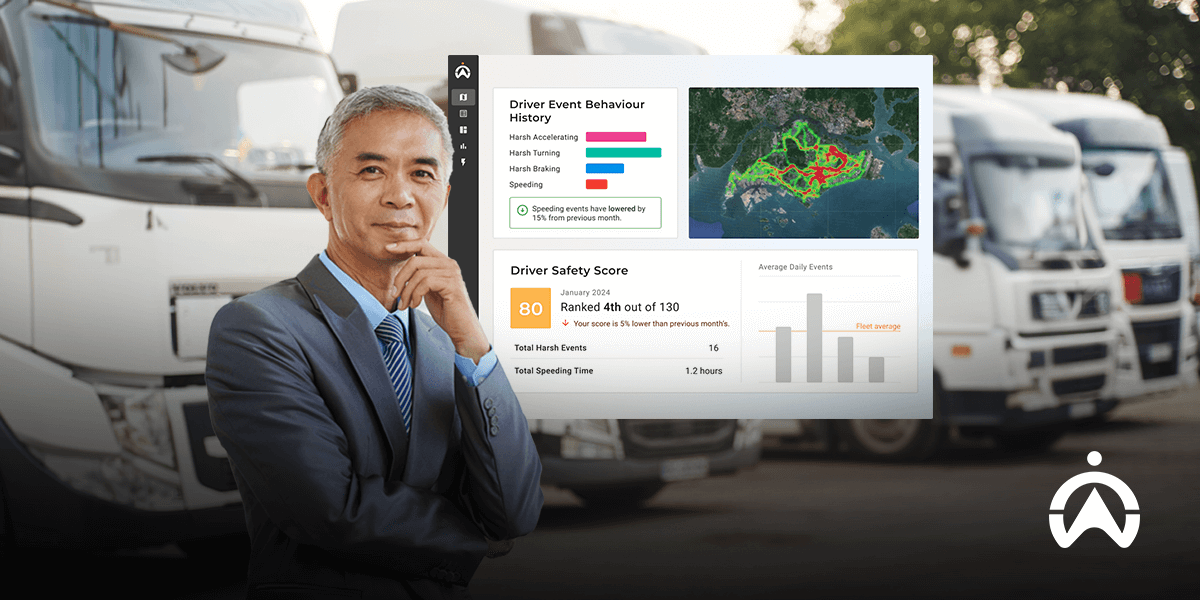 Pengusaha berdiri di depan armada truk dengan dasbor digital yang menampilkan fitur ADAS mobil untuk memantau keselamatan pengemudi.