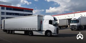 Wholesaler distribution trucks are parked in the warehouse as a link between producers and retailers.